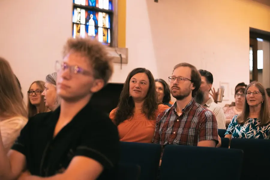Listening together during a gathering at ULC