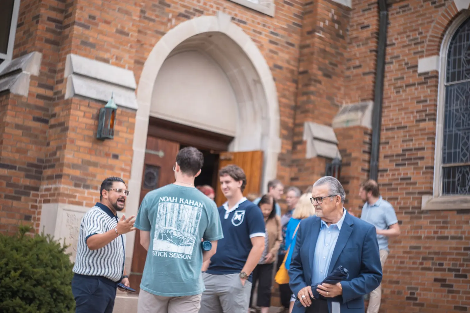 Conversation outside the chapel doors